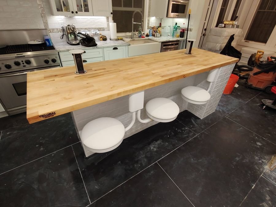 Butcher-block island with swivel stools